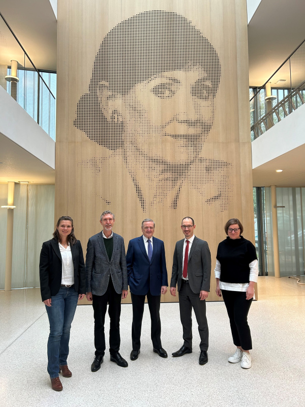 Group picture in front of the founder's portrait